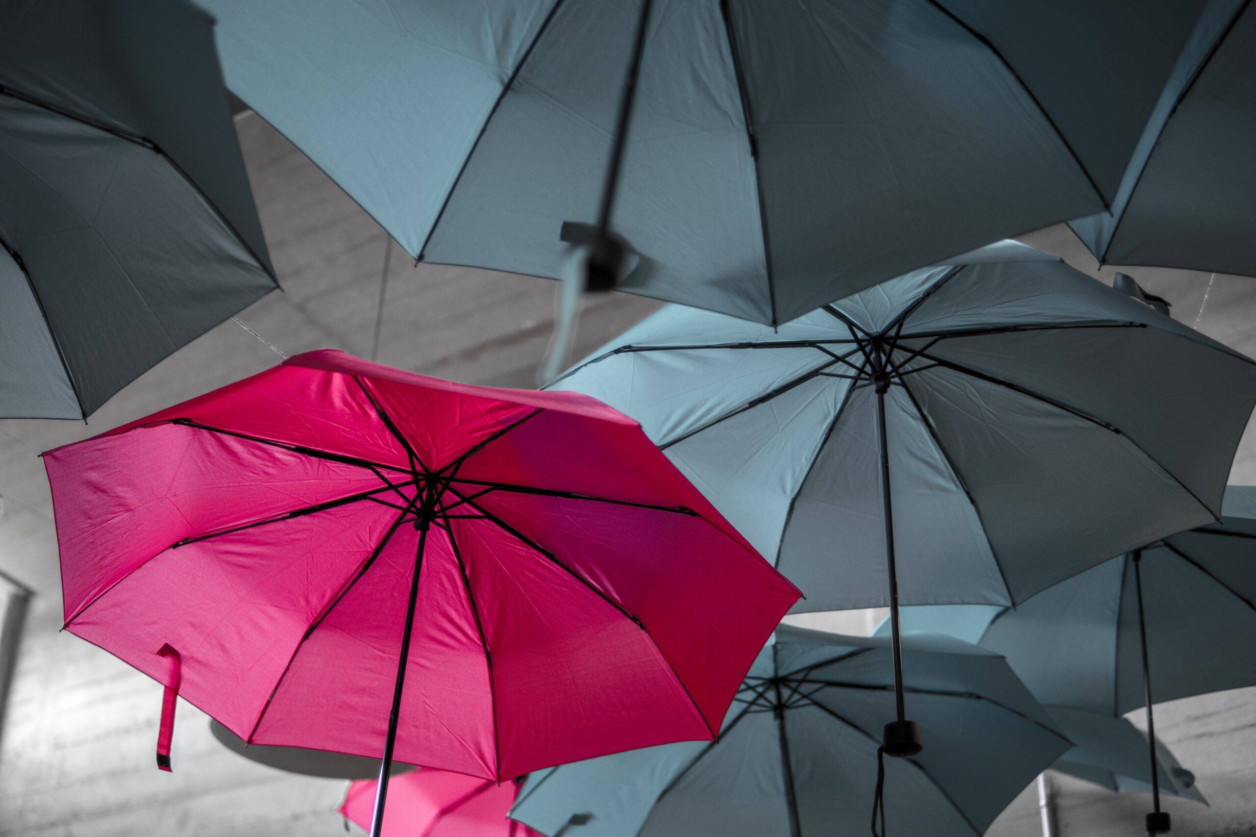 Stand out from the crowd with a red umbrella
